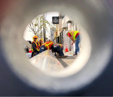 Crew installing a pole