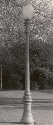 Single-globe decorative fluted street lighting post from the 1920s, showing an elegant narrow profile.